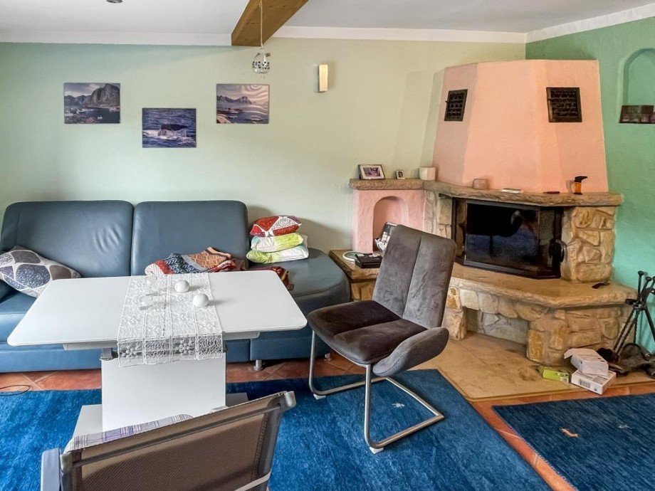Wohnraum mit Kamin Ferienhaus Altenbeuthen